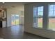 Living room features hardwood floors, backyard view and access to the dining room at 124 Willow Cameron Way, Angier, NC 27501
