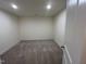 Bright, empty room with neutral carpet and freshly painted walls provides a blank canvas at 124 Willow Cameron Way, Angier, NC 27501
