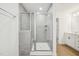 Modern bathroom showcasing a glass-enclosed shower and tiled walls at 124 Willow Cameron Way, Angier, NC 27501