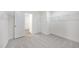 Spacious walk-in closet featuring metal shelving and neutral carpeting at 124 Willow Cameron Way, Angier, NC 27501