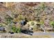Aerial view of property showing house, outbuildings, and surrounding trees at 12808 Old Stage Rd, Willow Springs, NC 27592