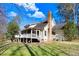 Home featuring a screened porch and a spacious deck overlooking the private backyard at 12808 Old Stage Rd, Willow Springs, NC 27592
