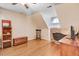 Finished bonus room with hardwood floors, a ceiling fan, and ample space for various uses at 12808 Old Stage Rd, Willow Springs, NC 27592