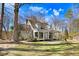 Charming white two-story home with a full front porch and mature trees in a large yard at 12808 Old Stage Rd, Willow Springs, NC 27592