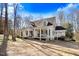 Beautiful two-story home with a spacious front porch, swing, and inviting curb appeal on a wooded lot at 12808 Old Stage Rd, Willow Springs, NC 27592