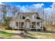 Inviting home with a full, covered front porch, perfect for relaxing and enjoying the outdoors at 12808 Old Stage Rd, Willow Springs, NC 27592