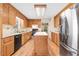 Functional kitchen with ample counter space, stainless steel refrigerator, and center island for meal prep at 12808 Old Stage Rd, Willow Springs, NC 27592
