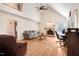 Cozy living room with a fireplace, vaulted ceilings, hardwood floors, and an abundance of natural light at 12808 Old Stage Rd, Willow Springs, NC 27592