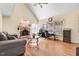 Inviting living room with vaulted ceilings, hardwood floors, a brick fireplace and lots of natural light at 12808 Old Stage Rd, Willow Springs, NC 27592