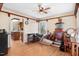Living room with hardwood floors, detailed trim, and a view into the adjacent kitchen at 12808 Old Stage Rd, Willow Springs, NC 27592