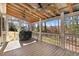 Inviting screened porch with wood floors, ceiling fans, and views of the surrounding greenery at 12808 Old Stage Rd, Willow Springs, NC 27592