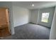 Bedroom with a plush carpet, neutral paint, and a sunlit window at 1308 Hazelnut Ridge Ln, Knightdale, NC 27545