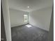 Room with carpet flooring and natural light from a window at 1308 Hazelnut Ridge Ln, Knightdale, NC 27545