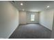 Large room with carpet flooring and natural light from a window at 1308 Hazelnut Ridge Ln, Knightdale, NC 27545