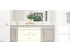 Bright bathroom featuring dual sinks, a large mirror, and stylish decor at 1308 Hazelnut Ridge Ln, Knightdale, NC 27545