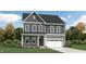 Charming two-story home with a covered porch and attached two-car garage, complemented by a beautifully landscaped front yard at 1308 Hazelnut Ridge Ln, Knightdale, NC 27545