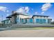 Modern style building with black trim and large windows, surrounded by landscaped grounds at 1308 Hazelnut Ridge Ln, Knightdale, NC 27545