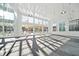 Large flex space perfect for fitness classes or gatherings, with ample windows for natural light at 1308 Hazelnut Ridge Ln, Knightdale, NC 27545