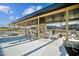 Community pool with a covered area with stone columns, lounge chairs, and landscape views at 1308 Hazelnut Ridge Ln, Knightdale, NC 27545