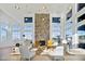 Community space featuring a stone accent wall and many large windows for natural light at 1342 Hazelnut Ridge Ln, Knightdale, NC 27545