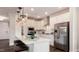 Bright kitchen features quartz countertops, stainless appliances, and modern pendant lighting at 1342 Hazelnut Ridge Ln, Knightdale, NC 27545