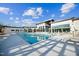 Community pool area featuring modern architecture, sun loungers, and inviting blue water at 1342 Hazelnut Ridge Ln, Knightdale, NC 27545