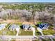 Aerial view of a neighborhood with mature trees and well-manicured lawns at 149 Bonica Creek Dr, Garner, NC 27529