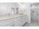 Elegant bathroom featuring double vanity, stone countertops, modern fixtures, and a tiled shower/tub at 149 Bonica Creek Dr, Garner, NC 27529