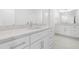 Elegant bathroom features a double vanity, stone countertops, modern fixtures, and great lighting at 149 Bonica Creek Dr, Garner, NC 27529