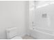 Modern bathroom showcasing a tiled shower/tub with a niche and contemporary fixtures at 149 Bonica Creek Dr, Garner, NC 27529
