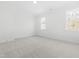 This bedroom features neutral carpet, a window, and is freshly painted at 149 Bonica Creek Dr, Garner, NC 27529
