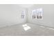 Inviting bedroom with plush carpet and two large windows providing lots of natural light at 149 Bonica Creek Dr, Garner, NC 27529