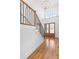 Elegant entryway with a staircase featuring wrought iron railings and wood floors at 149 Bonica Creek Dr, Garner, NC 27529