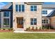 Close up of the home's front facade and solid wood door with glass panes and sidelights at 149 Bonica Creek Dr, Garner, NC 27529