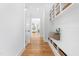 Hallway featuring built-in storage cubbies and a bench, with an inviting view into the living area at 149 Bonica Creek Dr, Garner, NC 27529