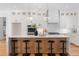 Spacious kitchen island with white countertop and seating for five at 149 Bonica Creek Dr, Garner, NC 27529