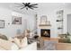 Living room with hardwood floors, ceiling fan and cozy fireplace to gather around with Gathering and friends at 149 Bonica Creek Dr, Garner, NC 27529