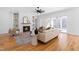 Living room showcasing a fireplace with shelving, leading to the patio with lots of natural light at 149 Bonica Creek Dr, Garner, NC 27529