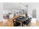 Bright open concept kitchen and dining area featuring a fireplace and ample natural light at 149 Bonica Creek Dr, Garner, NC 27529