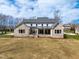 Expansive, brick home with a well-manicured lawn on a partially cloudy day at 149 Bonica Creek Dr, Garner, NC 27529