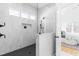 Modern shower with marble tile, glass enclosure, and black hardware at 149 Bonica Creek Dr, Garner, NC 27529