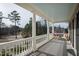 Inviting covered porch with beautiful views and seating area at 1530 The Preserve Trail, Chapel Hill, NC 27517