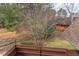 Balcony featuring a wooden railing with treed backyard view at 159 Finley Forest Dr, Chapel Hill, NC 27517