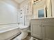 This is a bright bathroom featuring updated vanity, medicine cabinet, and shower with tub at 159 Finley Forest Dr, Chapel Hill, NC 27517