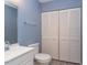 Cozy bathroom featuring a toilet, sink, mirror and shelved closet at 159 Finley Forest Dr, Chapel Hill, NC 27517