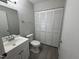 Bathroom featuring updated fixtures, large closet and white vanity at 159 Finley Forest Dr, Chapel Hill, NC 27517