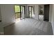 A bright bedroom offers a large closet with mirrored doors and sliding door access to a balcony at 159 Finley Forest Dr, Chapel Hill, NC 27517