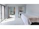 Bedroom featuring light gray walls, carpet, sliding glass doors, and mirrored closet doors at 159 Finley Forest Dr, Chapel Hill, NC 27517