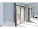 Bright bedroom with sliding door to balcony, mirrored closet, and neutral carpet at 159 Finley Forest Dr, Chapel Hill, NC 27517
