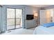 Bright bedroom with sliding glass doors to a deck, carpet and natural light at 159 Finley Forest Dr, Chapel Hill, NC 27517